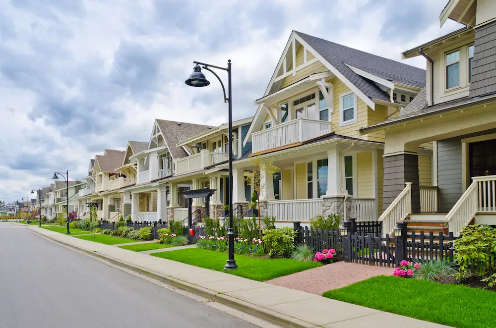 A residential street lined with single-family homes